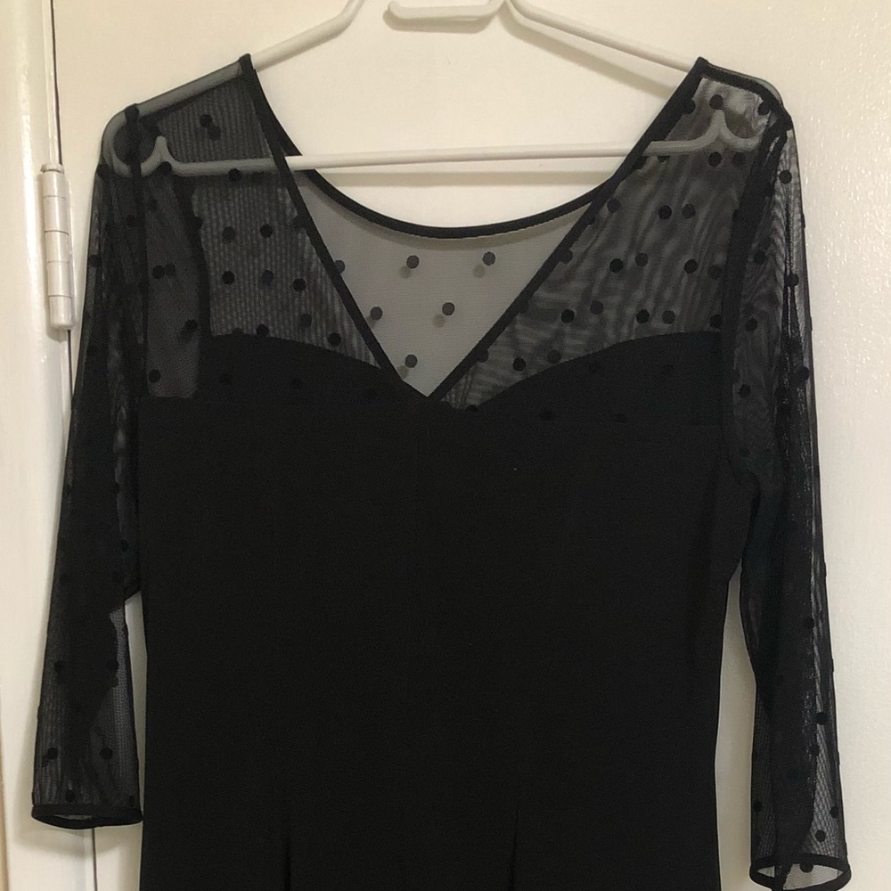 Black dress with sheer sleeves and neck panels
